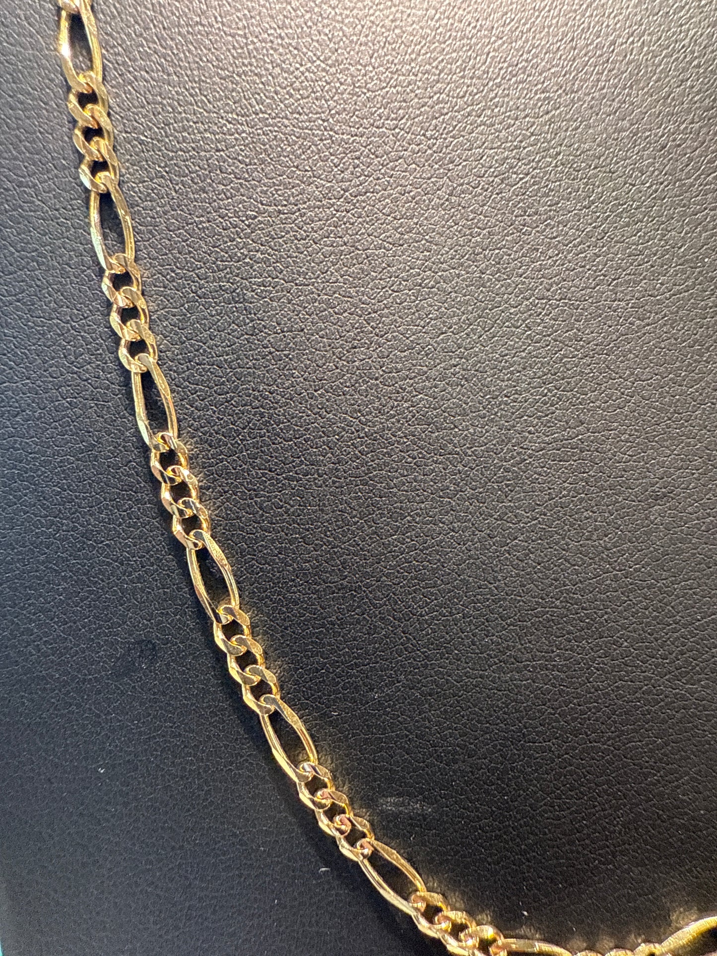 Gold figaro chain