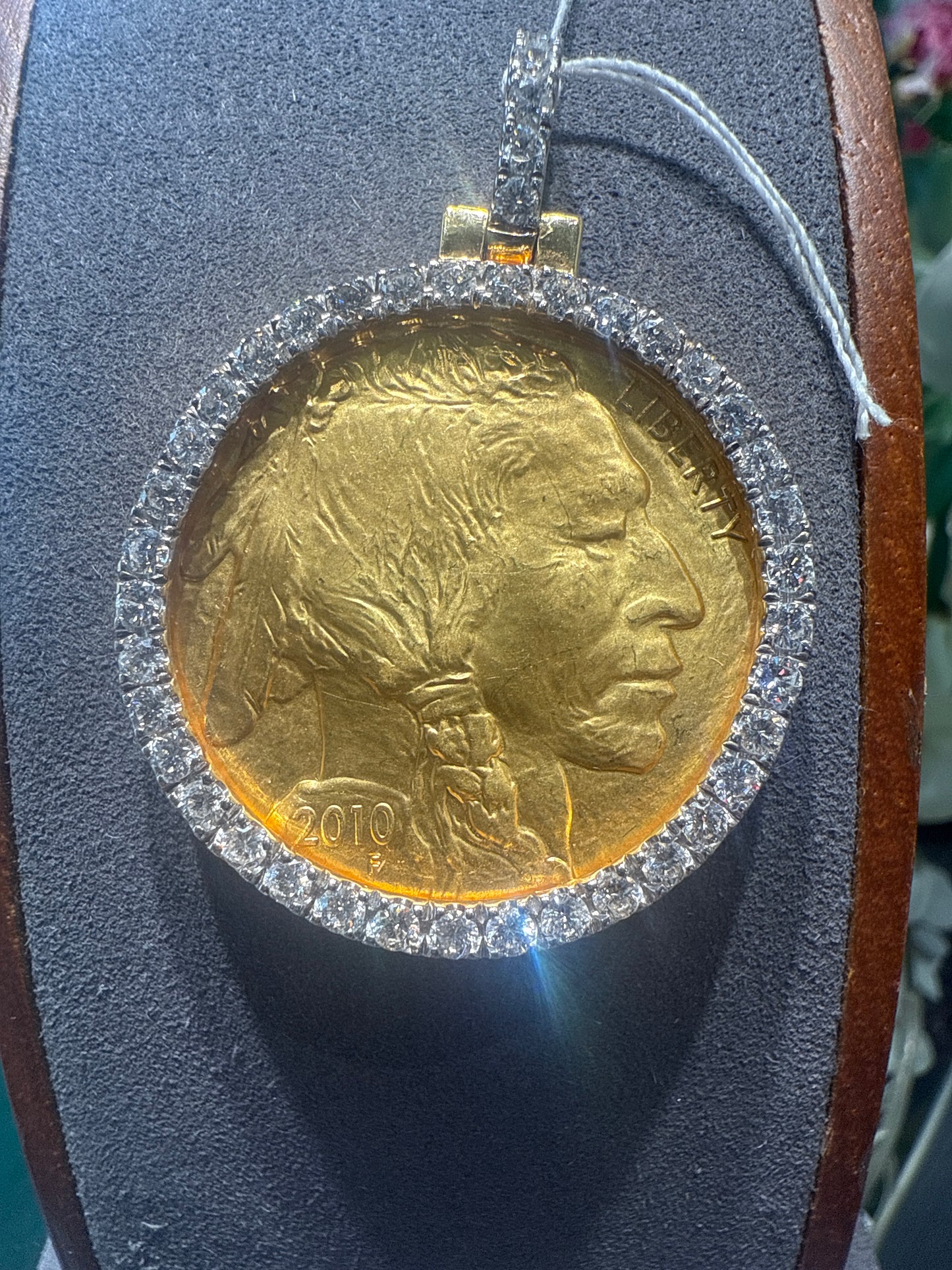 Gold coin w/diamond bezel