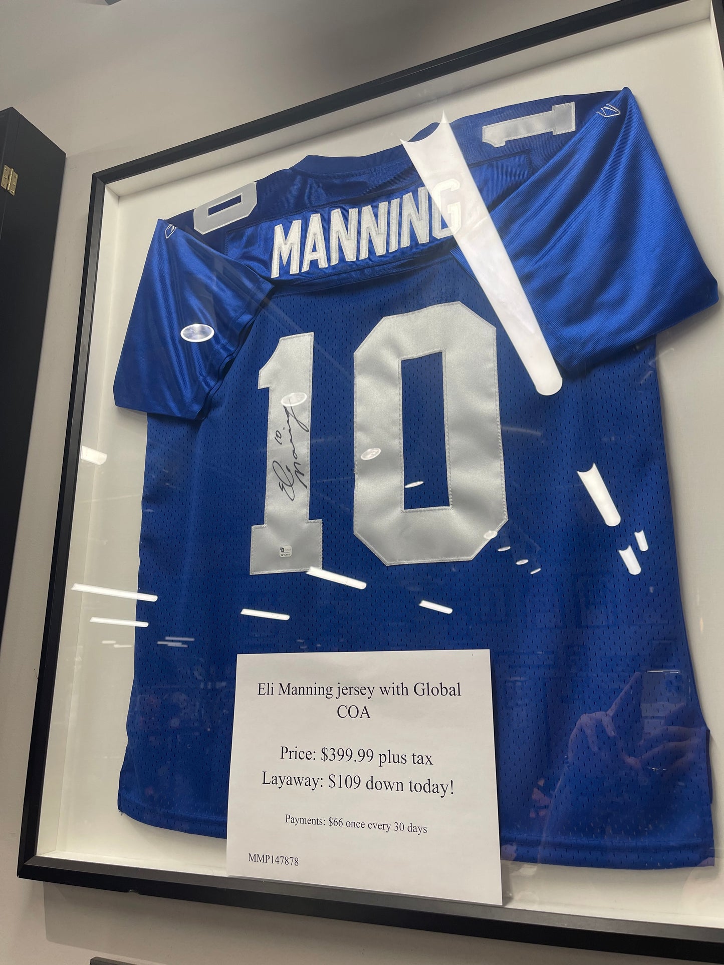 Framed Eli Manning signed jersey