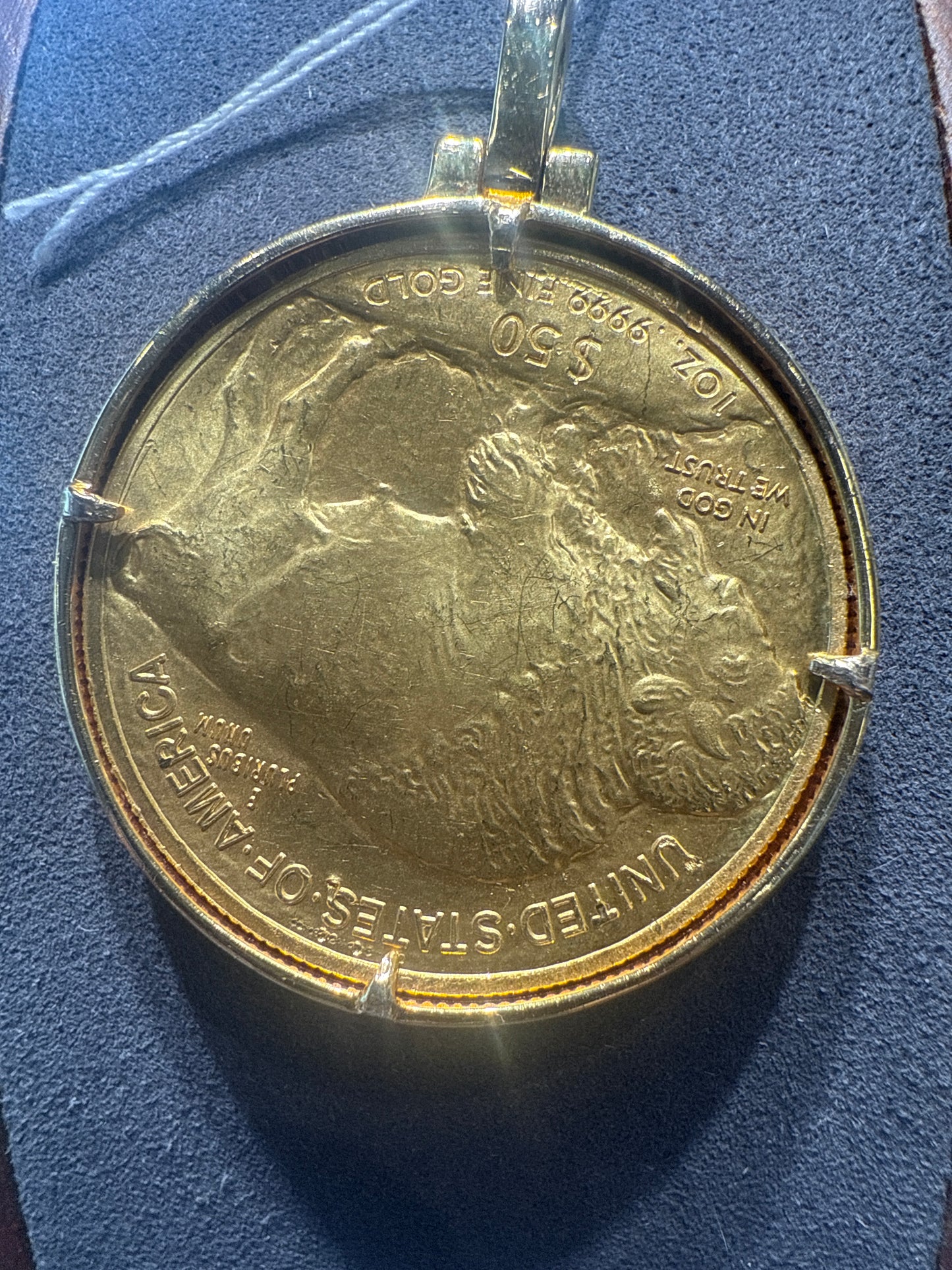 Gold coin w/diamond bezel