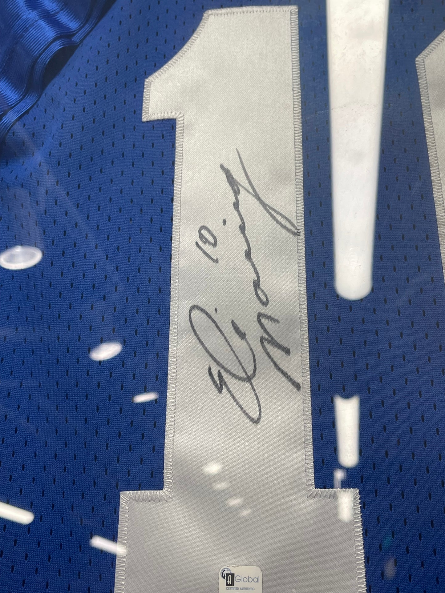 Framed Eli Manning signed jersey