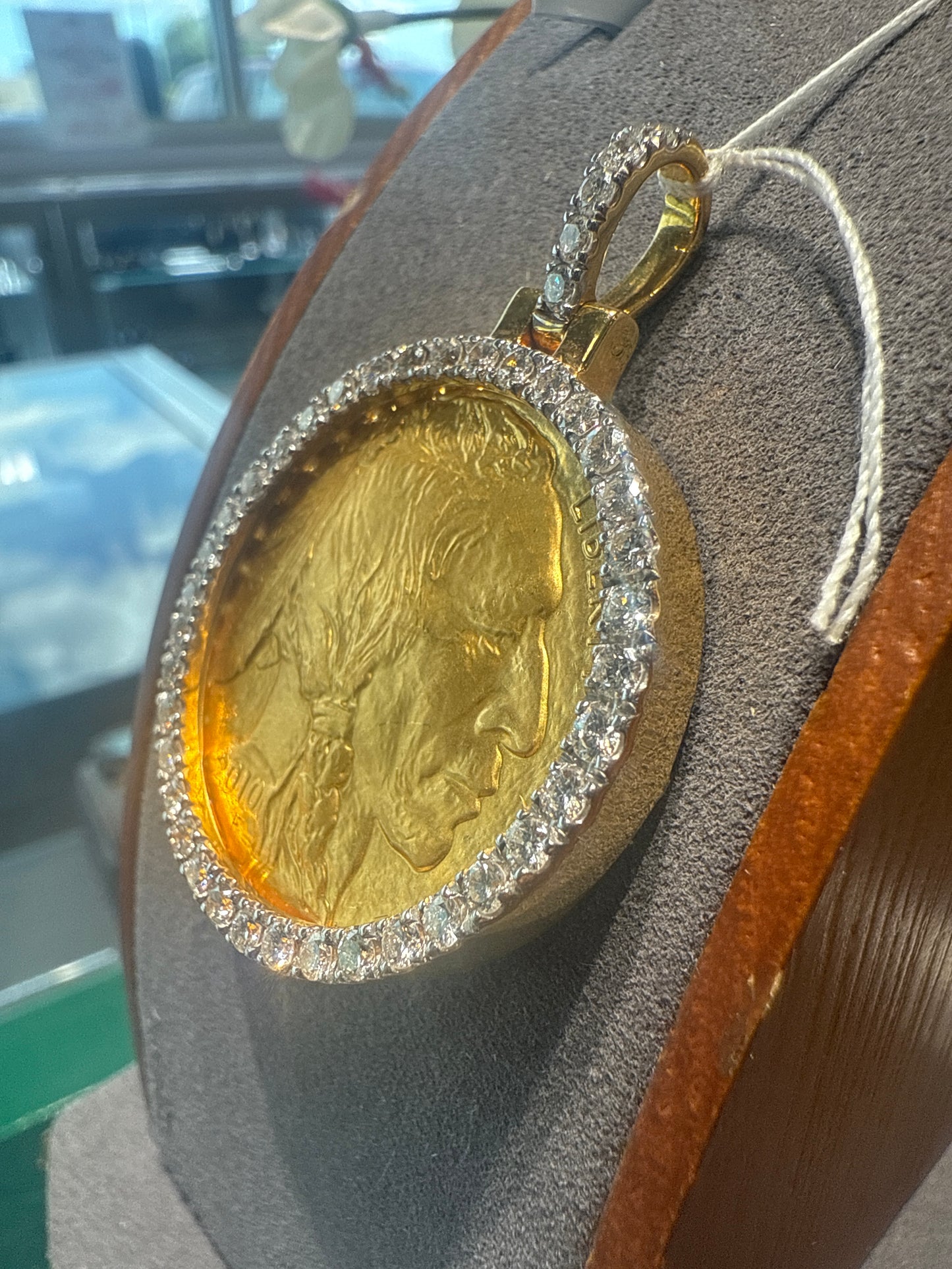 Gold coin w/diamond bezel