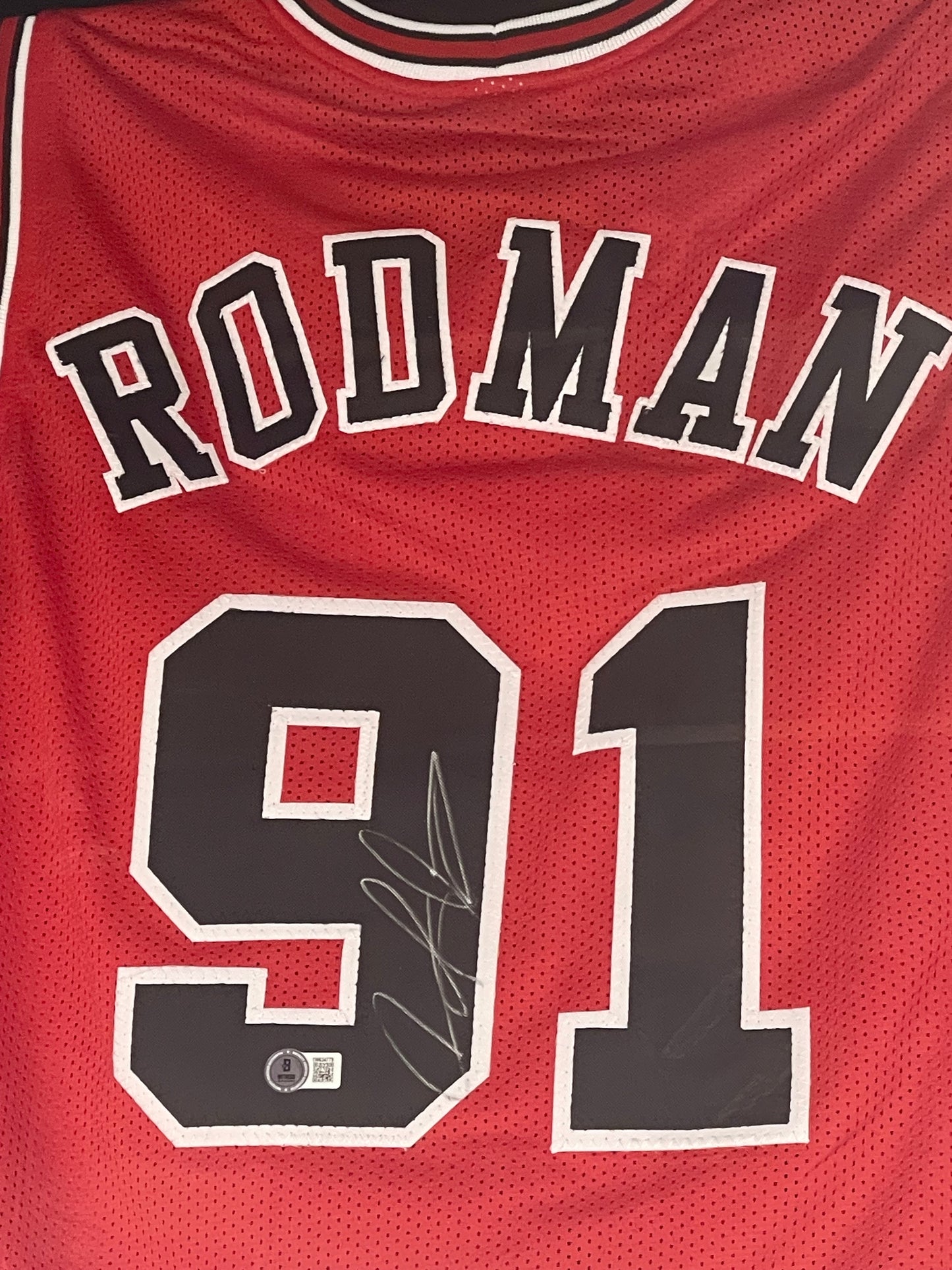 Framed Dennis Rodman signed jersey