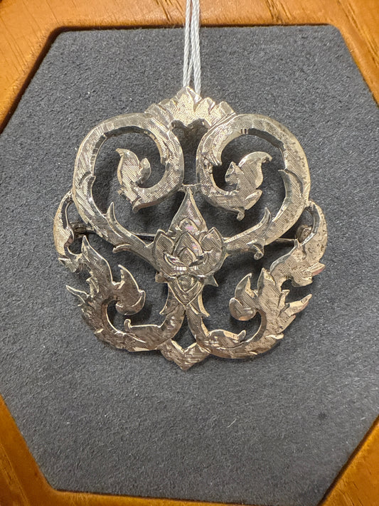 Silver charm/pin