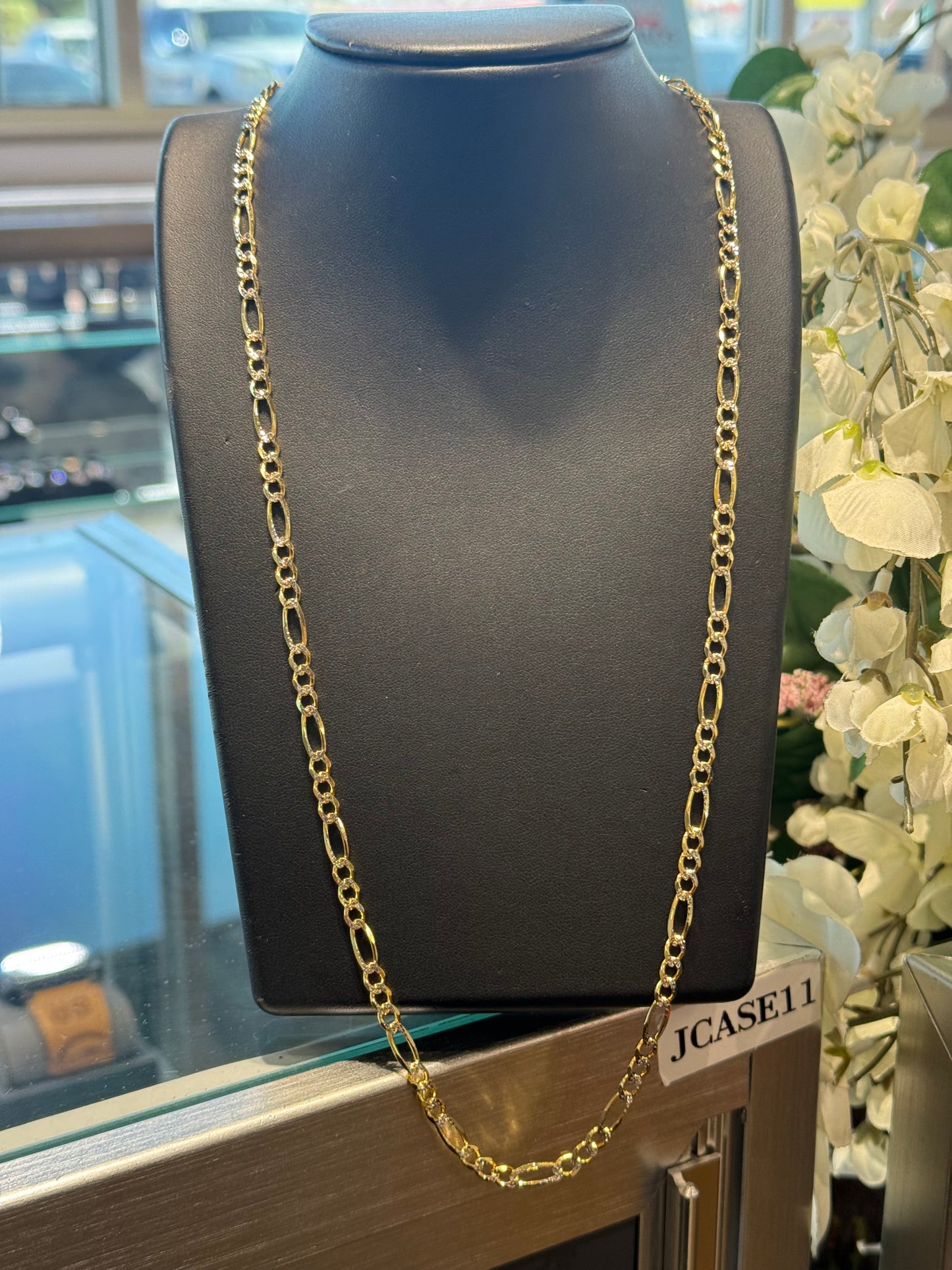 Gold figaro chain