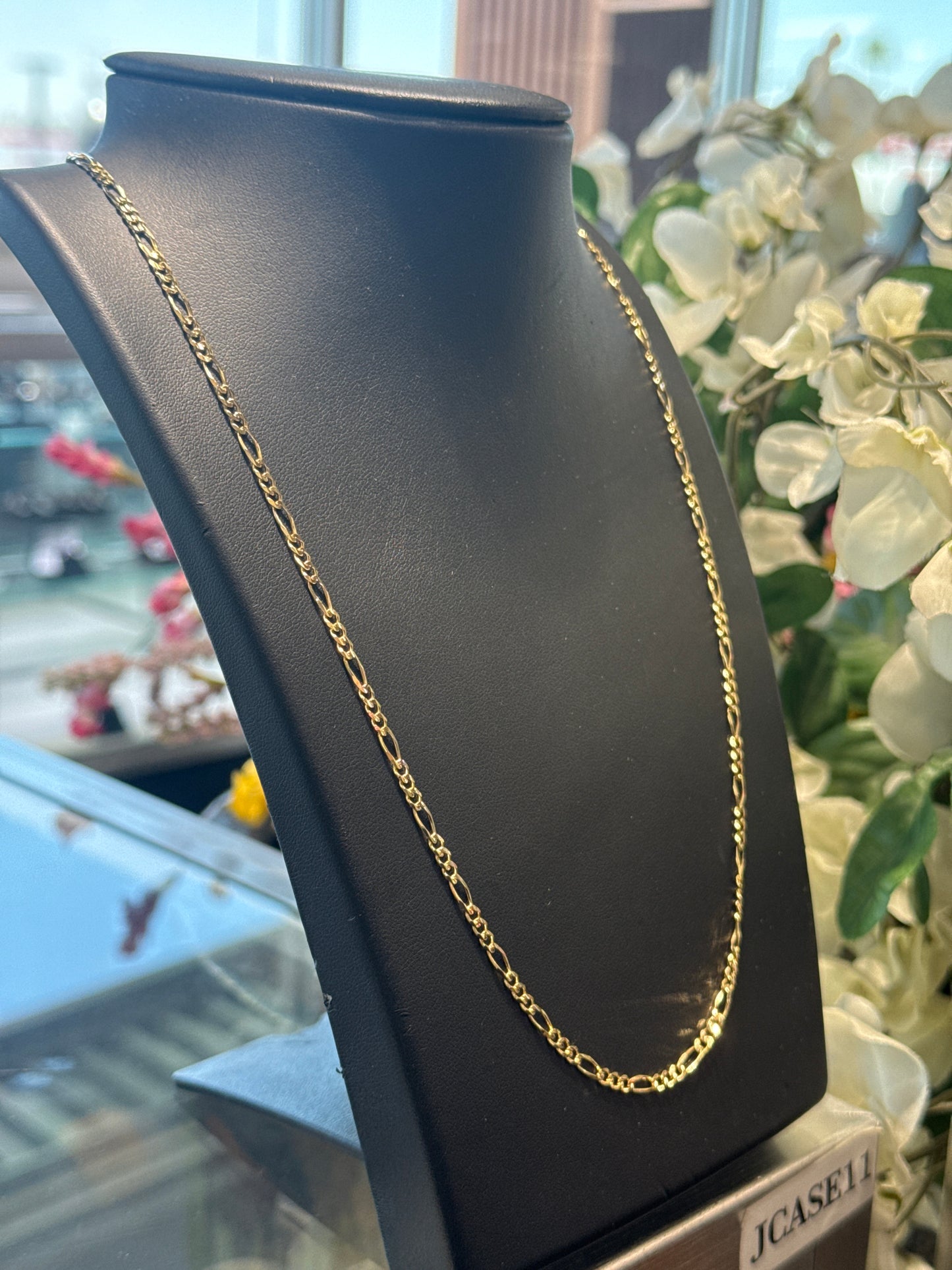 Gold figaro chain