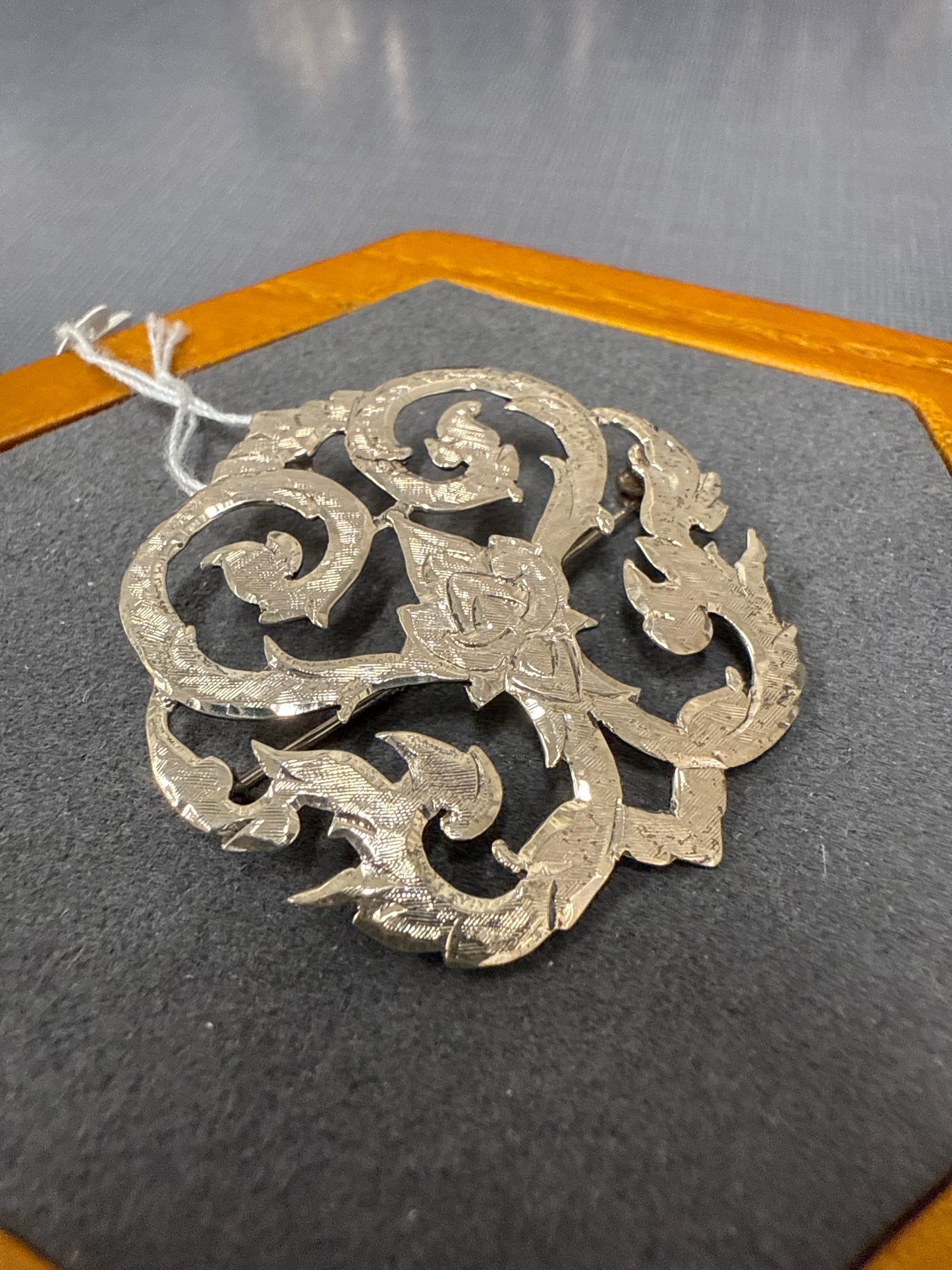 Silver charm/pin