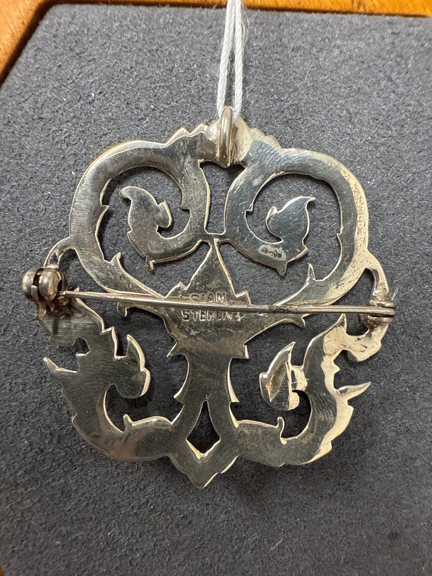 Silver charm/pin