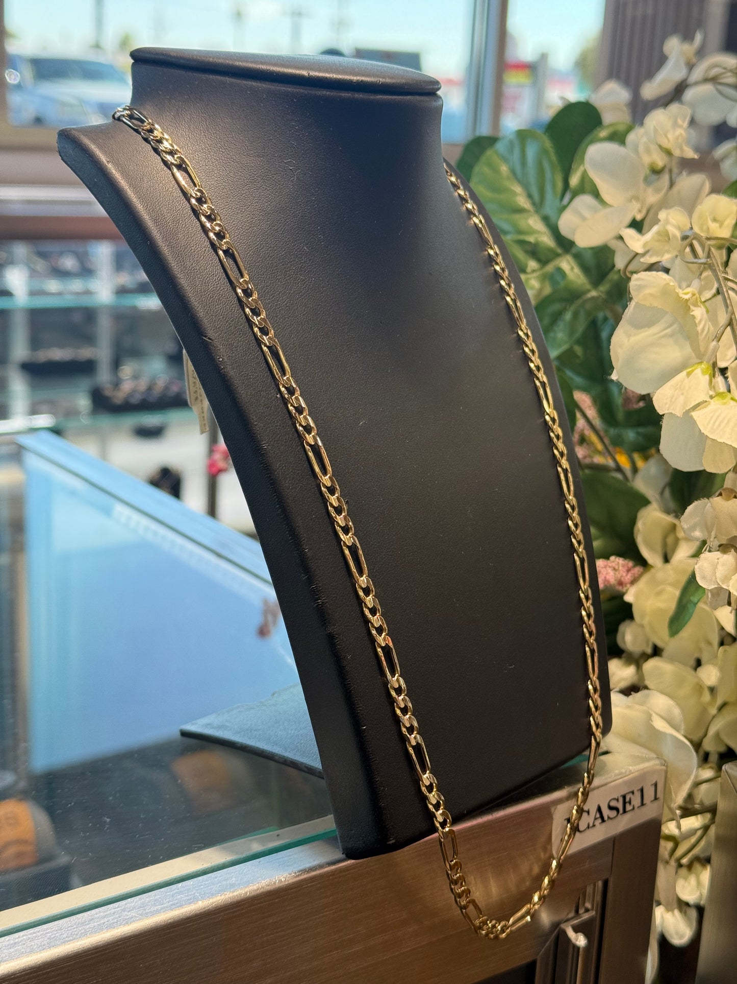 Gold figaro chain