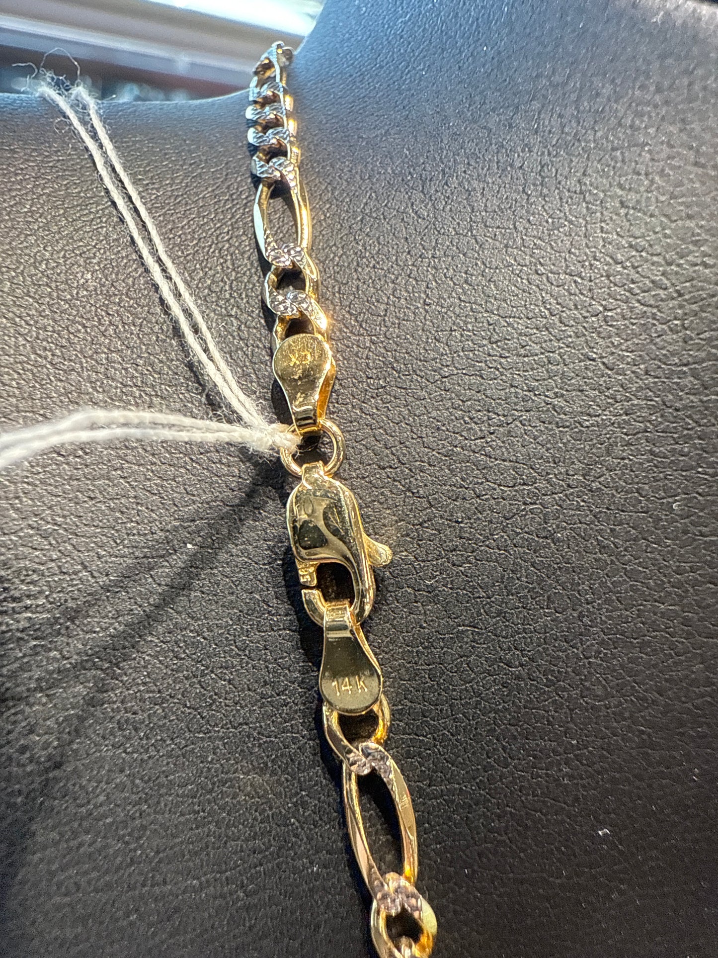 Gold figaro chain