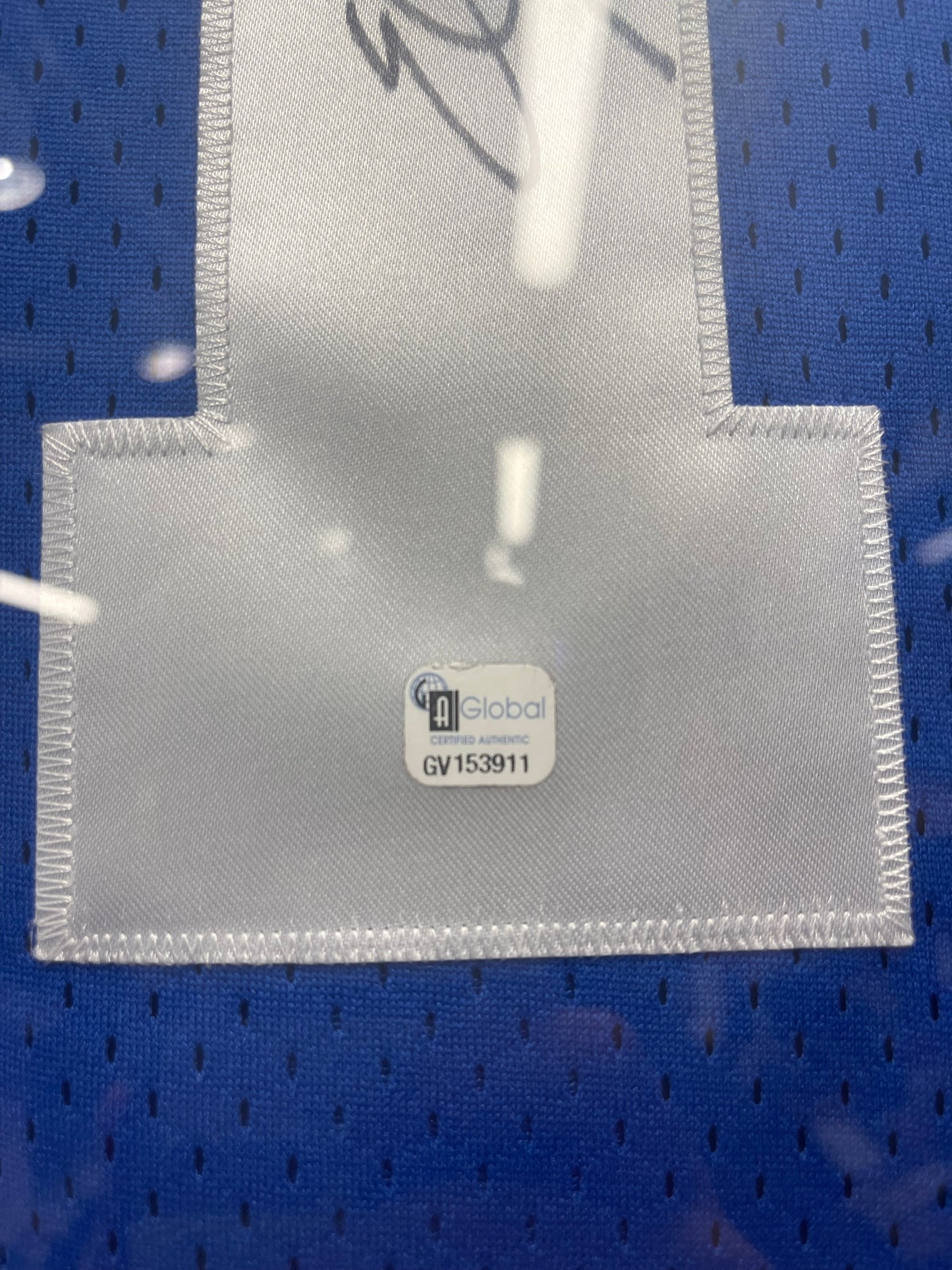 Framed Eli Manning signed jersey