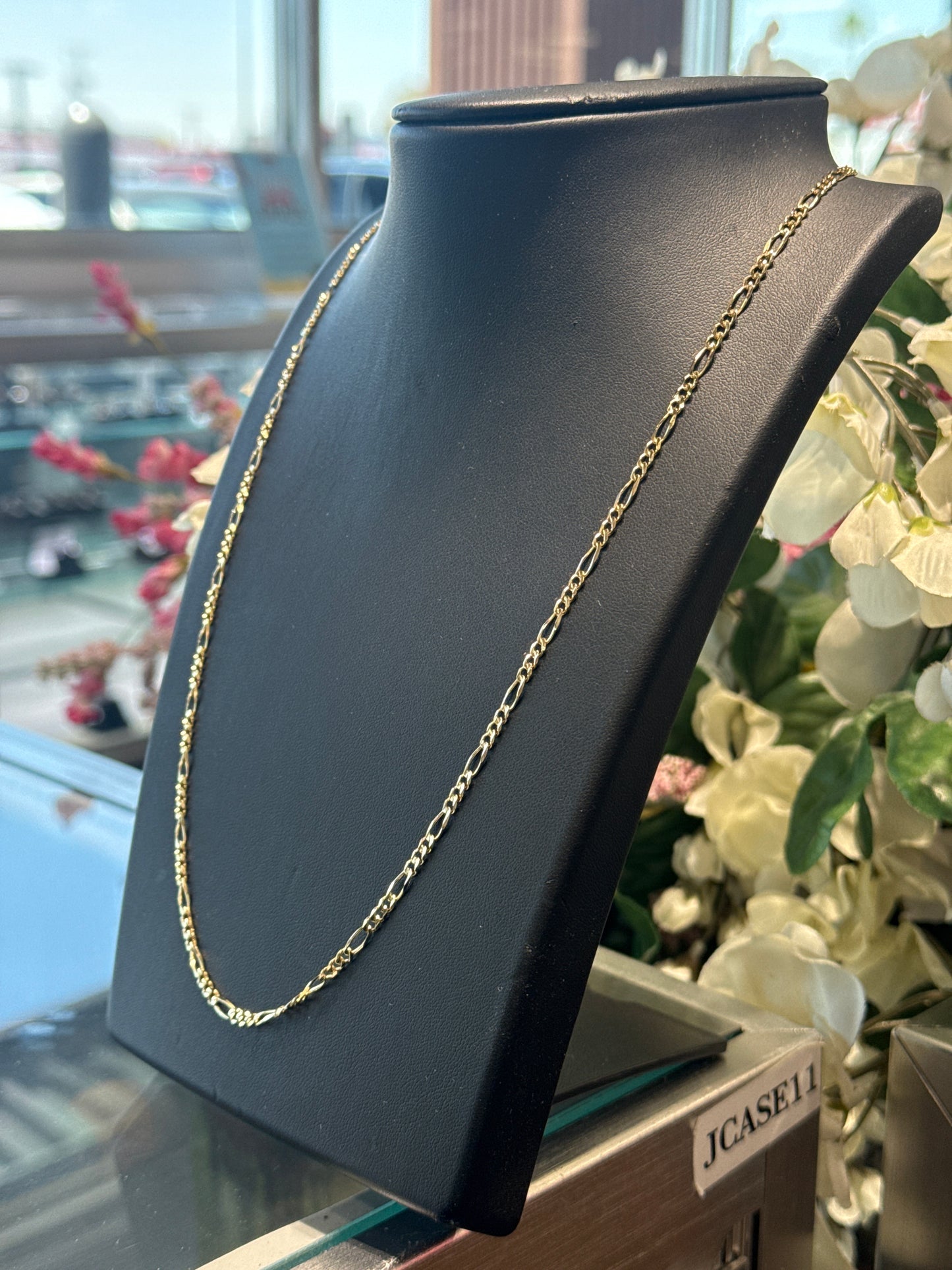 Gold figaro chain